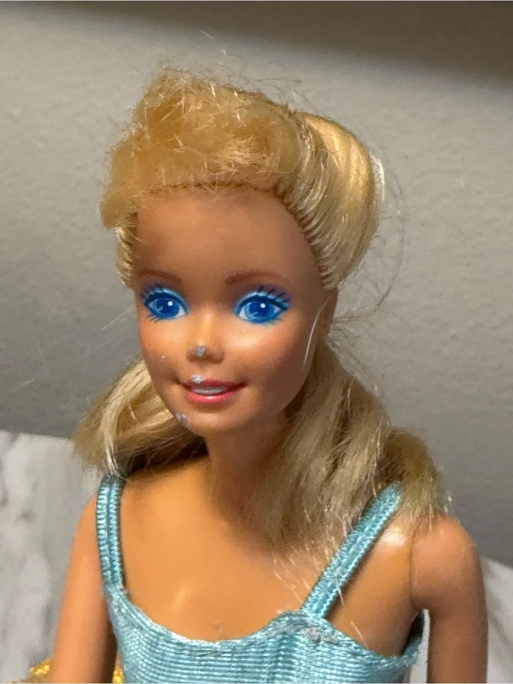 vintage blonde 1998 Bubble Fairy Barbie doll wearing a light blue top and a pink